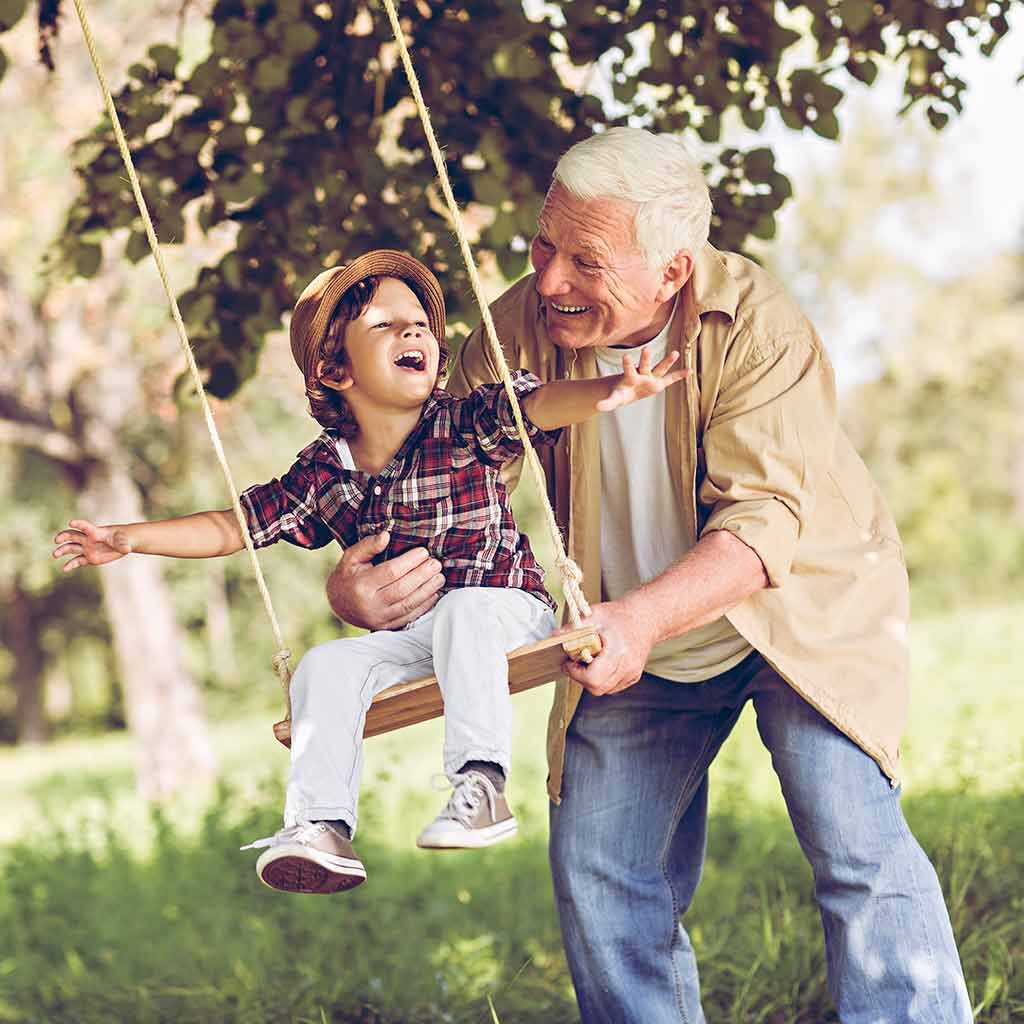 man uses traditional hearing aids to spend time with family